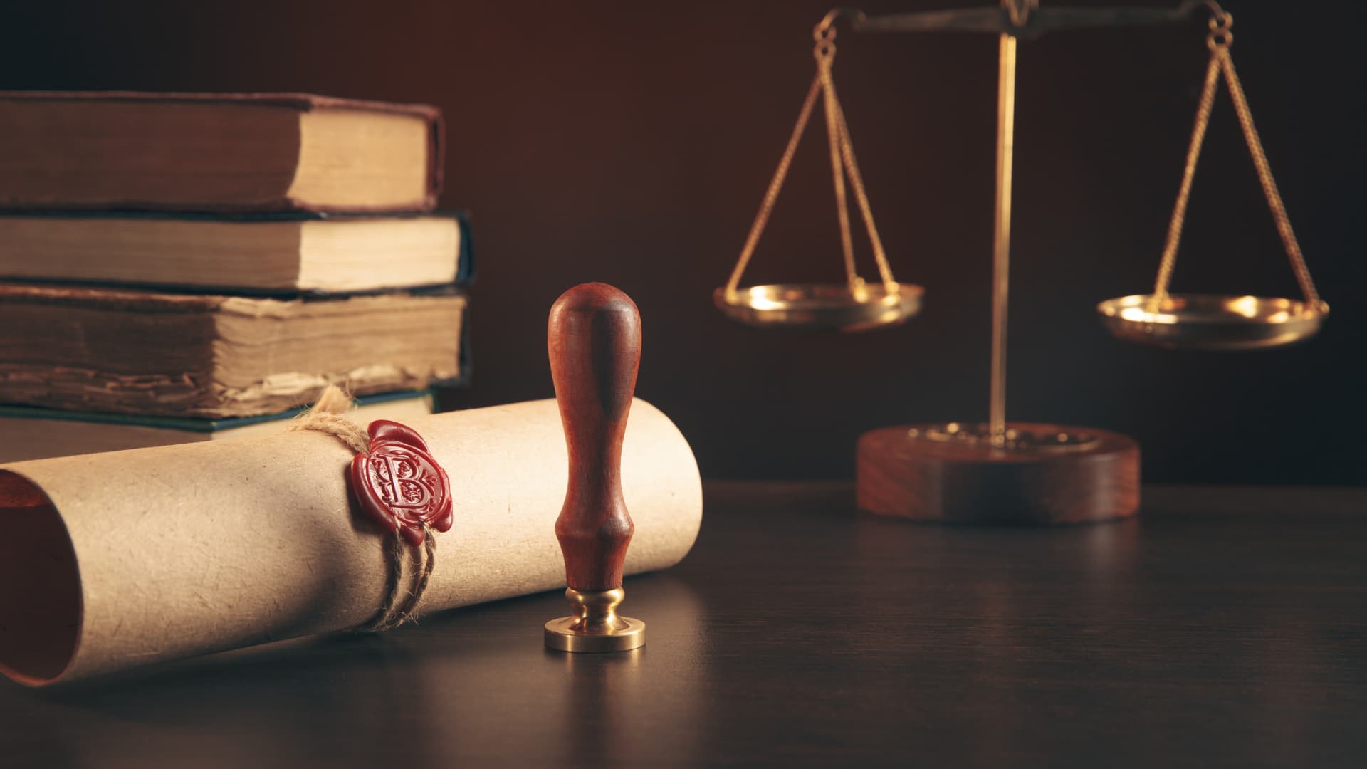 Scales of Justice with wax seal and books and document